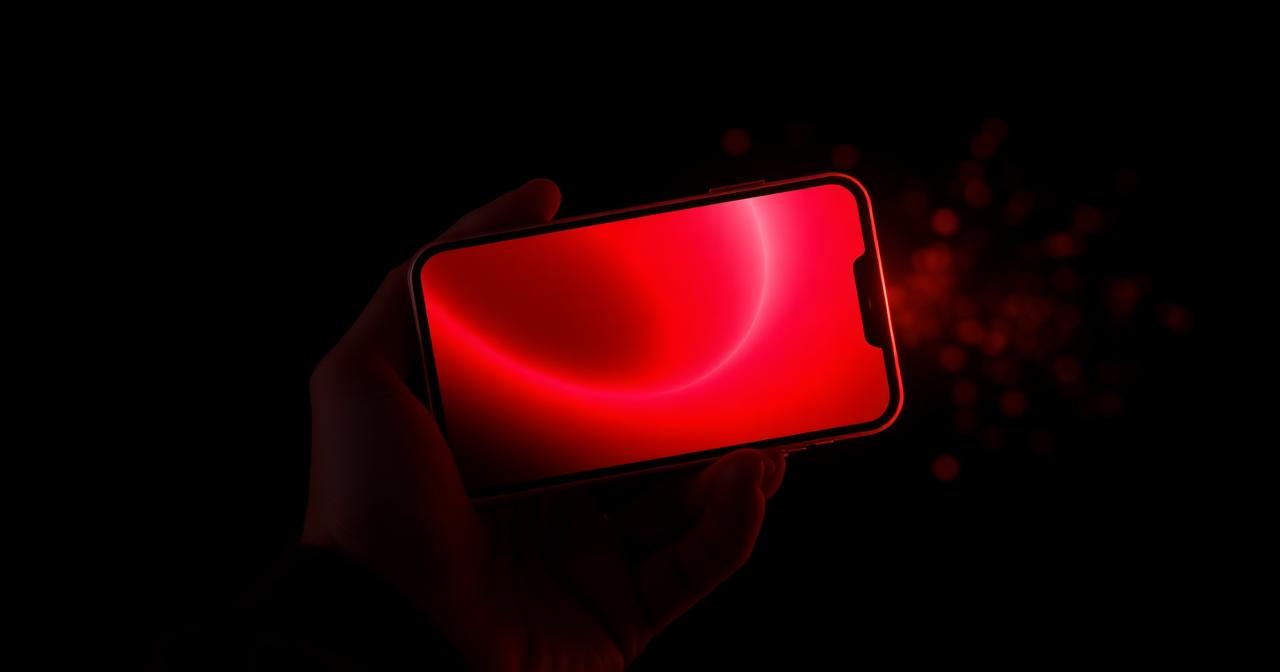 Smartphone met een rood gloeiend casinoscherm in een donkere kamer